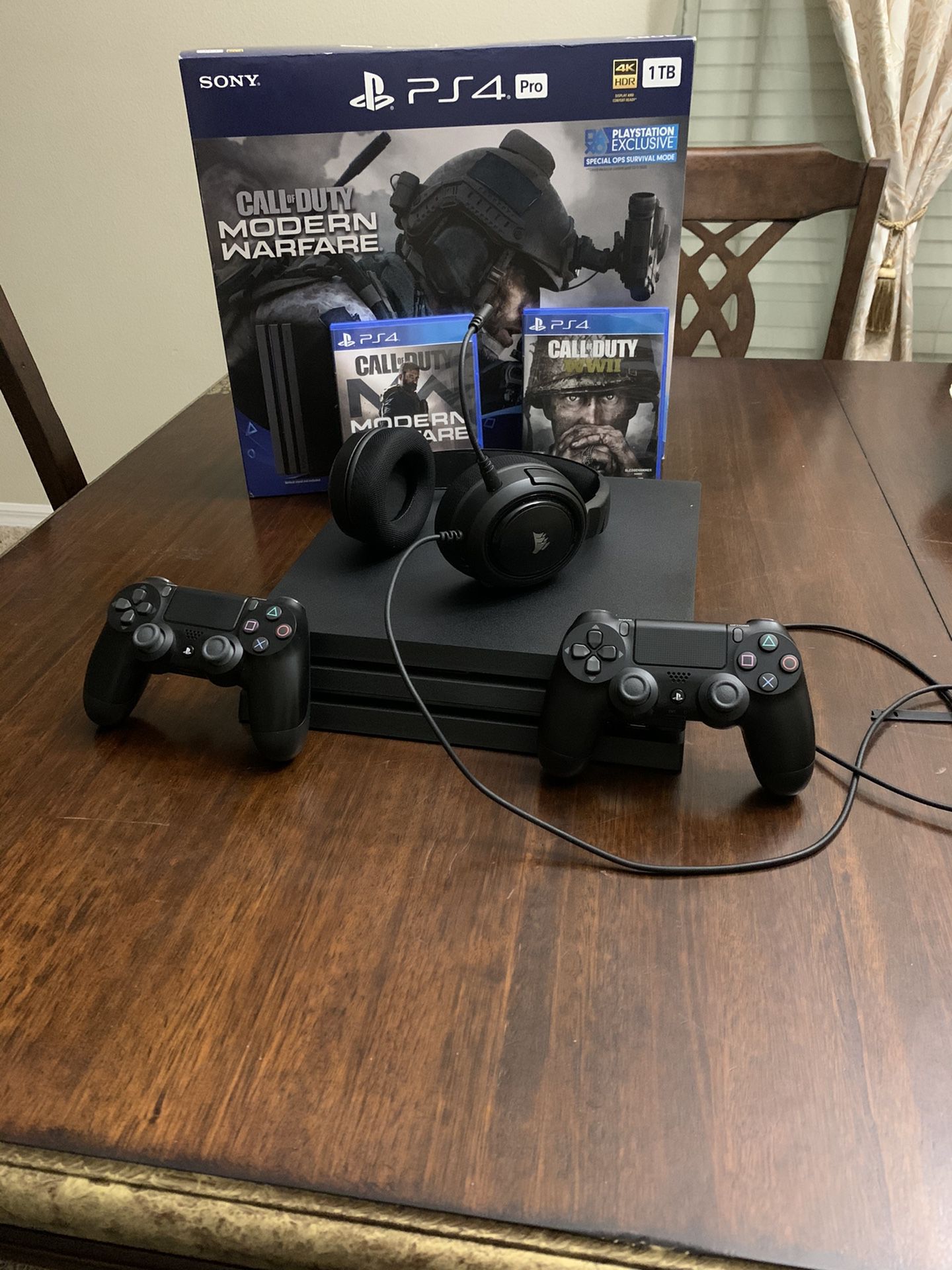 PS4 PRO 1tb with 2 controller and headphones and 2 games