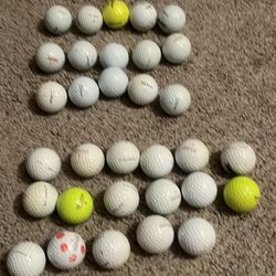 32 Used Kirkland and Titleist Golf Balls 