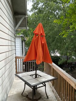 Umbrella , stand and table