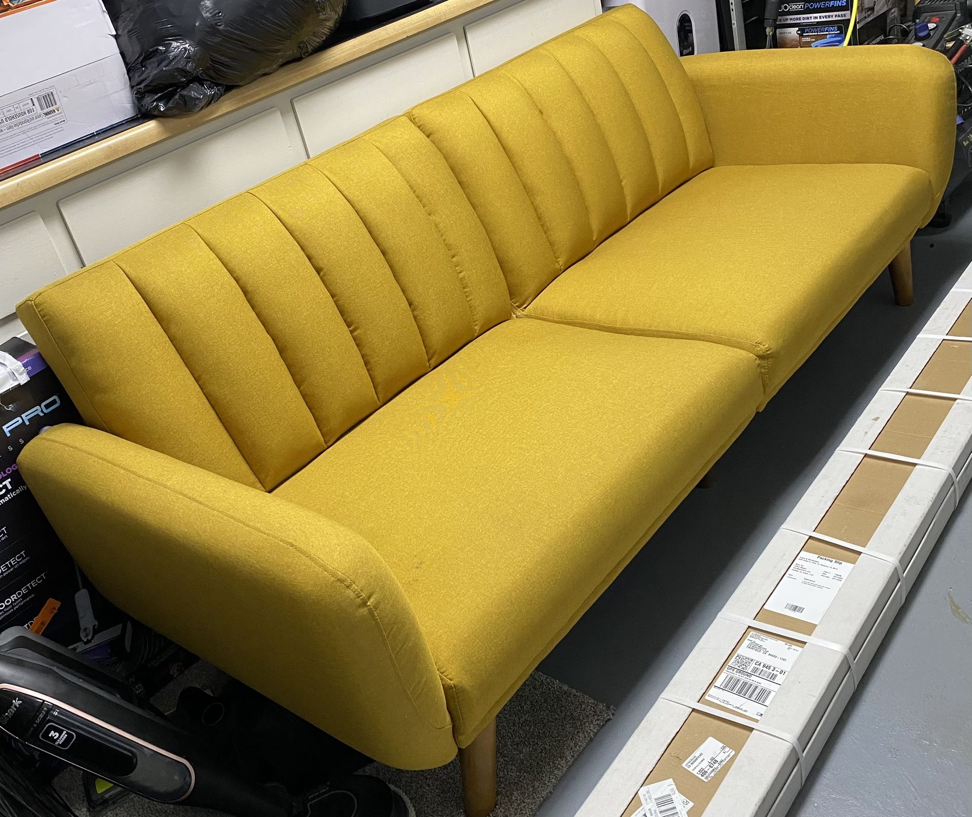 Used Novogratz 82 Inch Futon Sofa Bed in Faux Leather, Upholstered Couch Sleeper with Tufted Back, Mid-Century Modern Design, Mustard