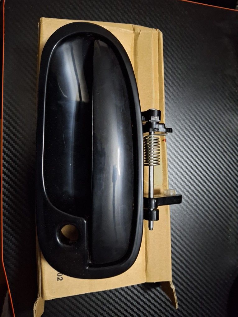 Ek Driver's side door handle.