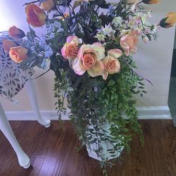 Hard plastic stand with peach roses