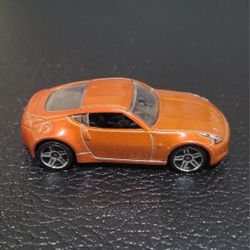 REALTOY NISSAN ORANGE 370Z MODEL CAR DIECAST RARE COLLECTIBLE 1:57