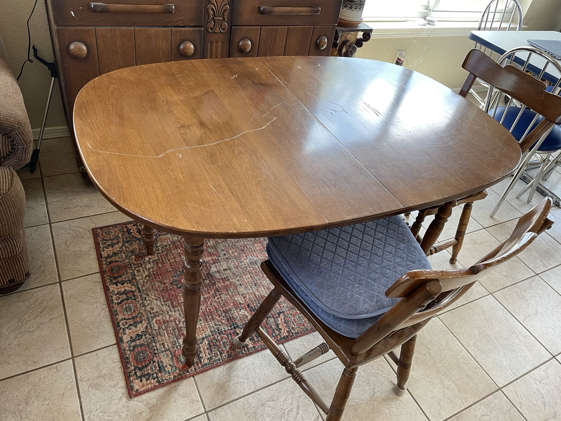 Dining Room Table (with Leaf) And Four Chairs