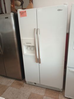 Whirlpool side by side Refrigerator white works great nice . Warranty . Delivery available . 2203 Fowler st. Ft. Myers 33901
