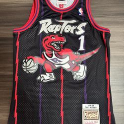 Mitchell & Ness Toronto Raptors Tracy Mcgrady #1 NBA HWC Swingman Stitched Sz S  100% authentic. Lightly worn, good condition.   The product is a Mitc