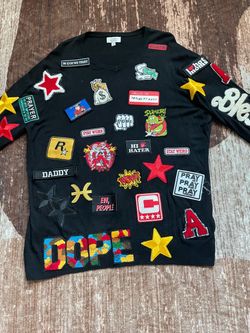 Black long sleeve sweater with colorful patches