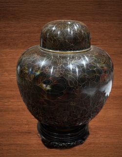VINTAGE CLOISONNÉ FLORAL LIDDED BRASS URN ON A WOOD STAND. 12”