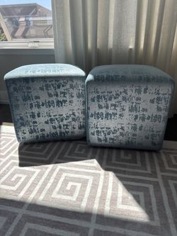 Two Blue Patterned Ottomans