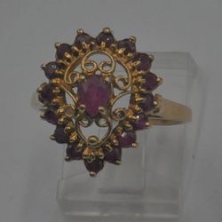 10KT YELLOW GOLD RING 3.5 GRAMS WITH RUBIES SIZE 8. MINT . 883140-1