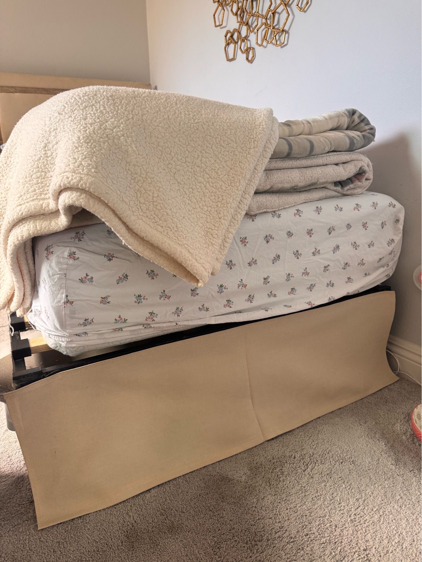 Twin bed in beige color with mattress