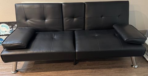 Black leather sofa (convertible to bed) for sale