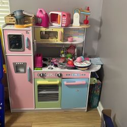 Girl Kitchen With Food And Kitchen Appliances 