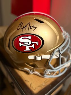 Autographed Christian McCaffrey San Francisco 49ers authentic football helmet.