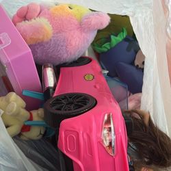 Two White Bags Filled With Toys 