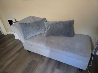 Grey chaise lounge with storage