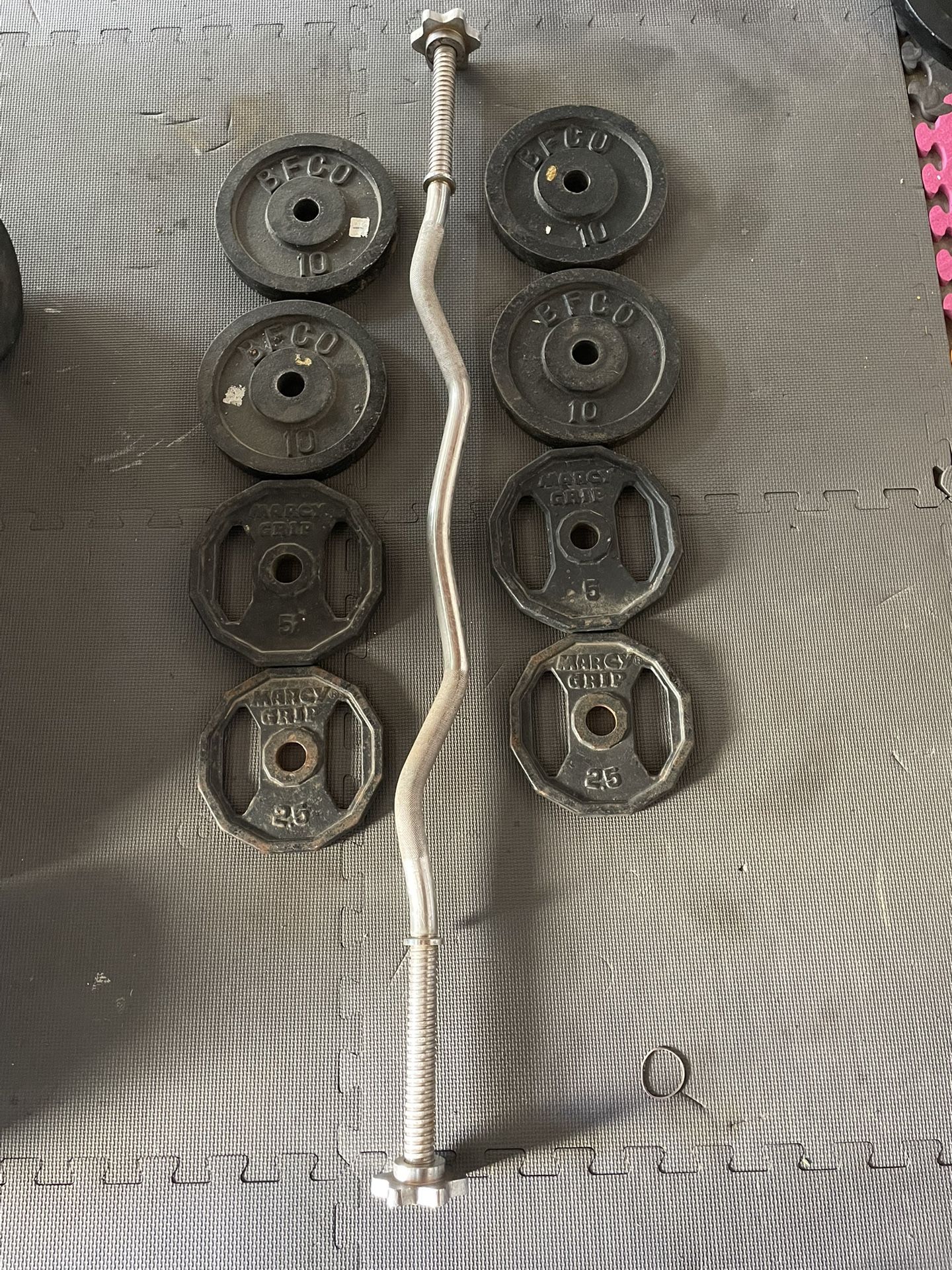 Weight Plates / Curl Bar. 50 Dollars