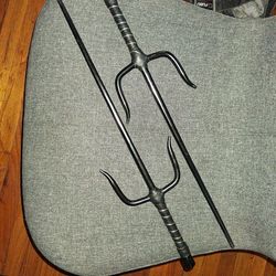 Two black metal Sai's