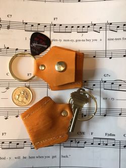 Guitar pick holder or Aldi quarter holder