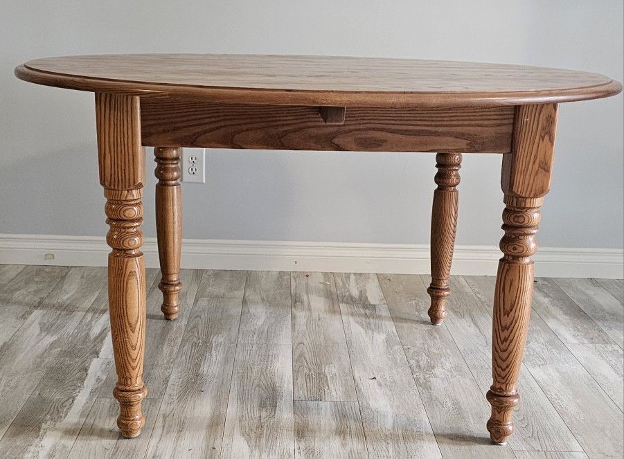 Solid Oak Table 54.5" Diameter Plus Two 12" Leaves