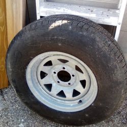 One 215/75/14"  Good Tire N Galvanized Rim $60 