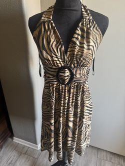 Halter neck dress with tie  back detail leopard print dress. Size M new  The fabric is stretchy  New