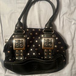 Kathy Van Zeeland black purse with gold embellishments, and buckles 