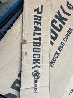 RealTruck BAKflip MX4 Hard Folding Tonneau Cover for 2020-2026 Ram: $580