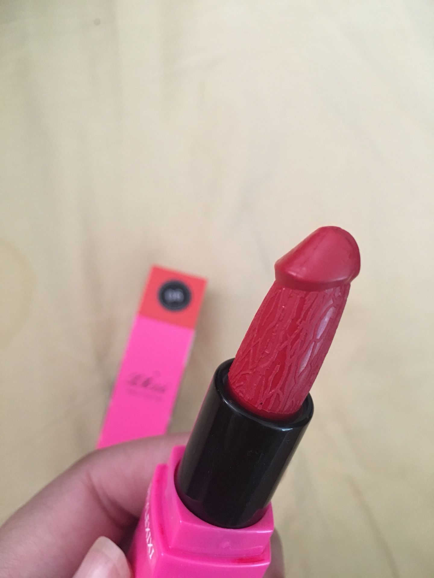 Funny red lipstick in shape of a penis