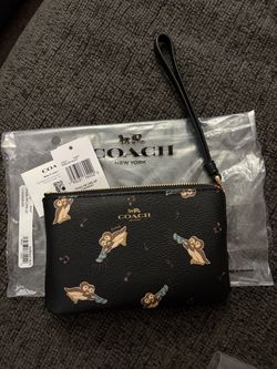 Coach penguin wristlet