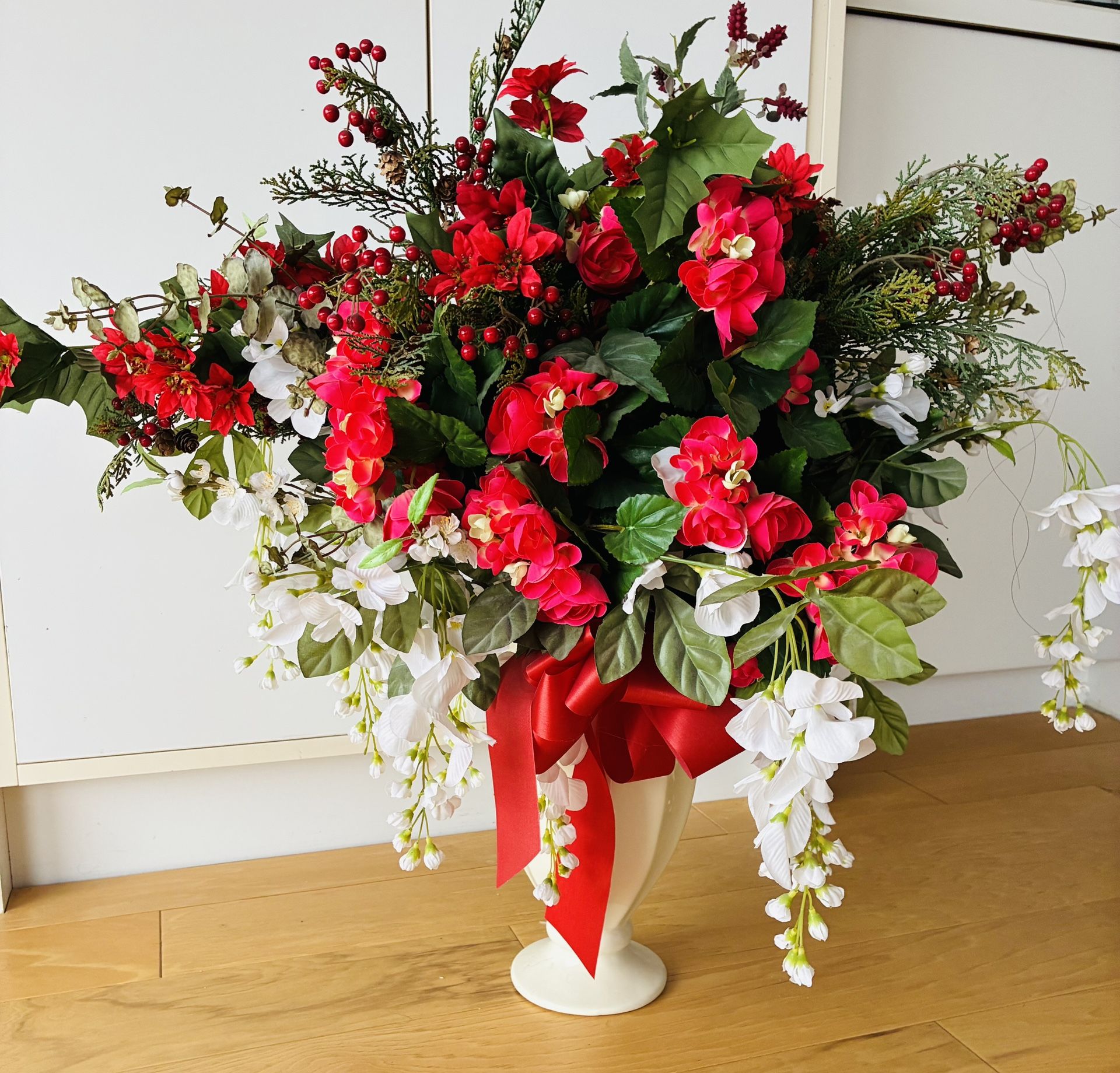 Floral Arrangement w/Artificial Flowers, 30” HighX30” WideX24” Deep Set in White Ceramic 12” High Vase w/red satin Bow.