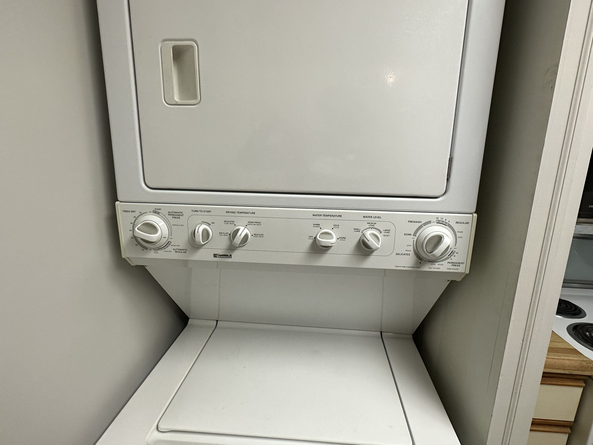 Clean, well-maintained Kenmore Stacked Washer & Dryer.