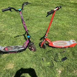 A pair of electric scooters with charger