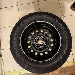 Brand new 215 /60R 16 tire with rim