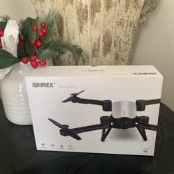 Used SIMREX X900 Drone Optical Flow Positioning RC Quadcopter   *Missing Battery *it has some pink stains on it *some of the wings have knicks on it a