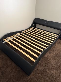 Queen size black leather bed