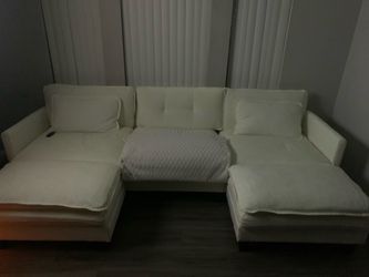 Cream sofa w footrest and pillows