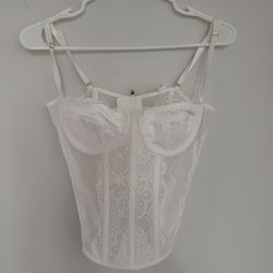 White lace corset top with adjustable straps and lace-up back #corsetry #lace