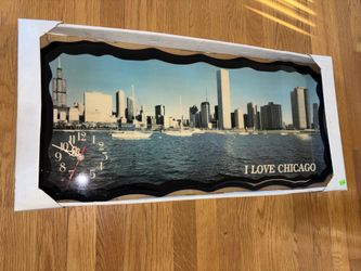 Chicago skyline vintage wall clock.  Measures 14”x32”.  Keeps perfect time