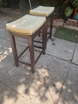 Two high bench nice condition  size 26” high, 14” long 12” wide, wood material and polyurethane sitting pads, nice condition, 30.00 both