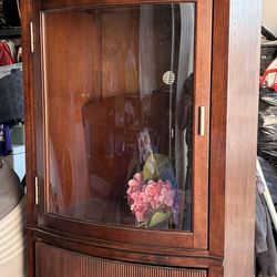 Wooden curio cabinet with drawers