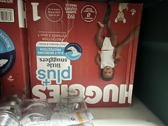 two boxes of huggies size 1