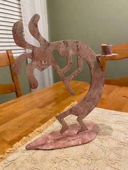 Southwest metal pink Kokopelli candle holder. Good condition . Rustic / cabin / indoor / outdoor.