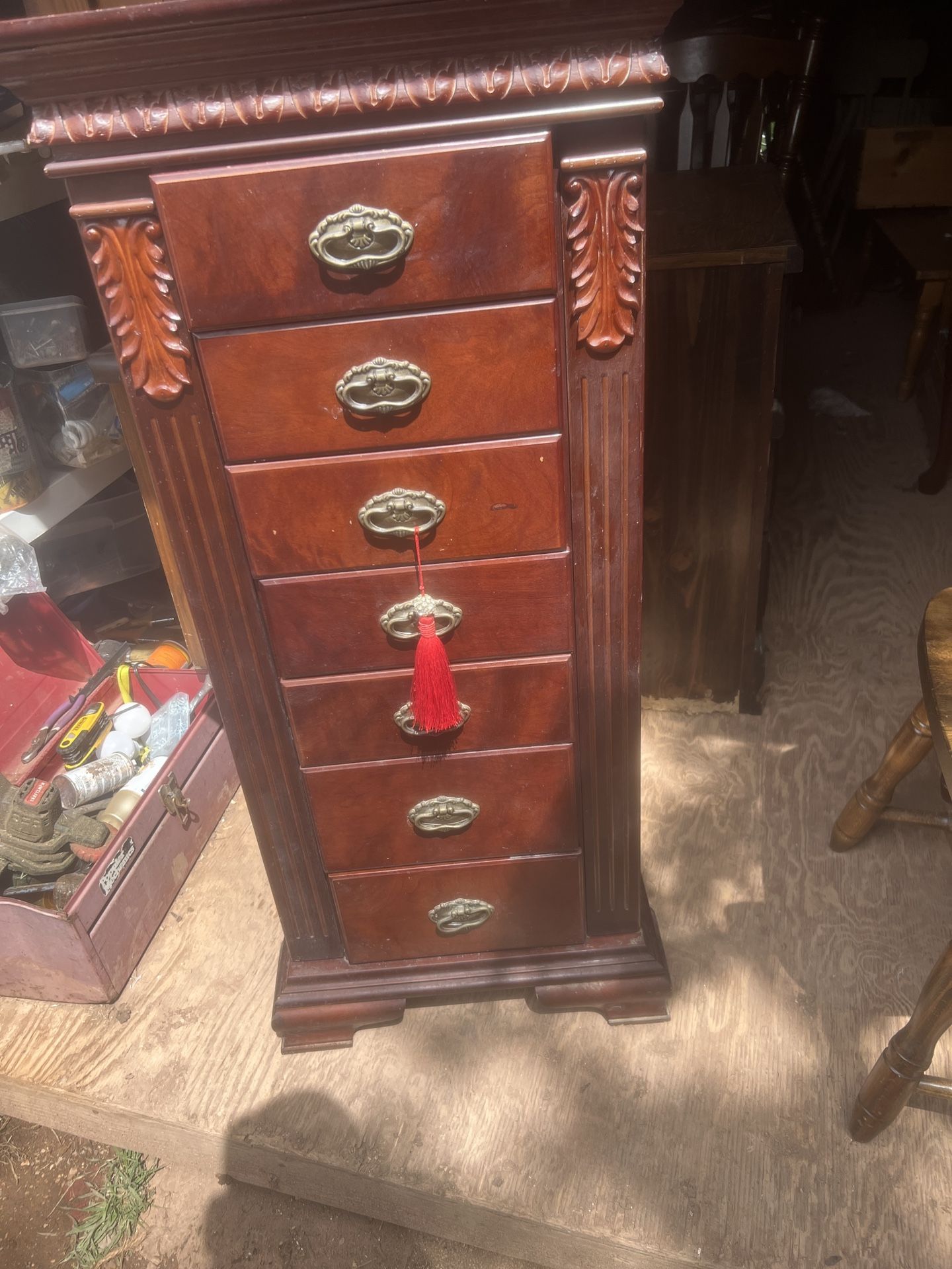 a pretty jewelry cabinet its 43 inches tall 19 inches wide and 13 inchez deep needs a good cleaning