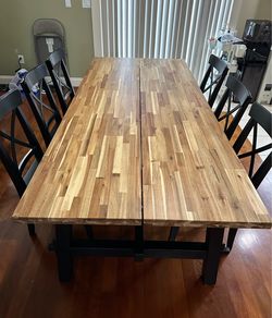 Ikea Skogsta Solid Wood Dining Table and 6 Ingolf Chairs