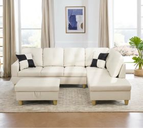 White leather sectional couch and ottoman