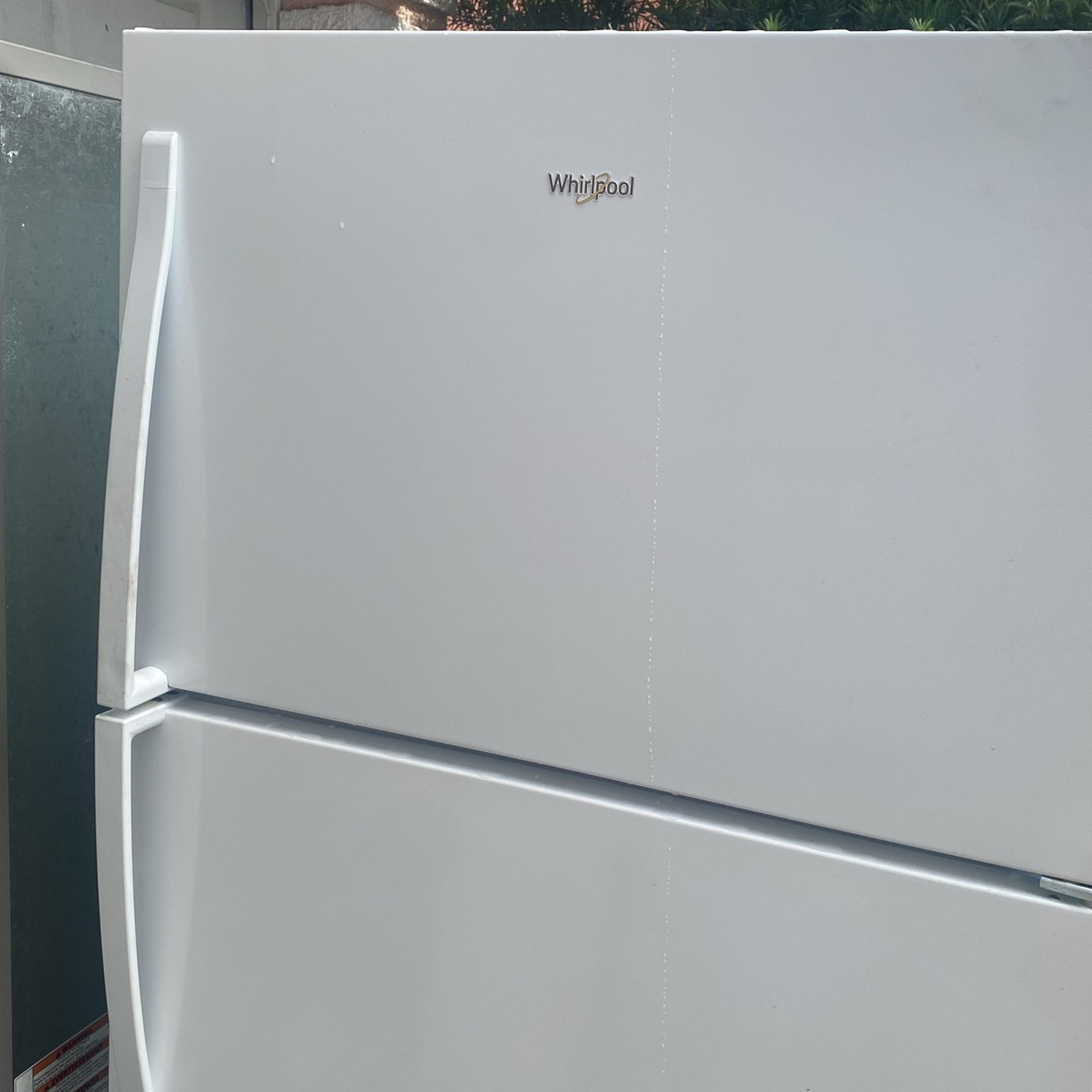 White whirlpool Fridge.