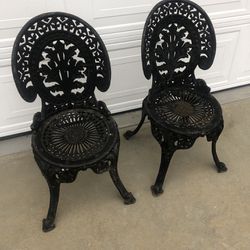 Pair of antique cast-iron chairs