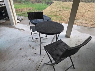 Brown small wicker bistro table with 2 chairs