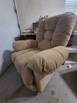 Tan swivel rocker recliner